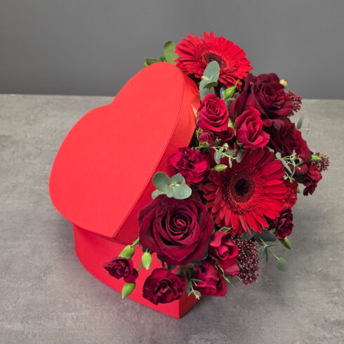Luxury red heart-shaped flower box with roses, gerberas and eucalyptus by BLOOMSI Canada