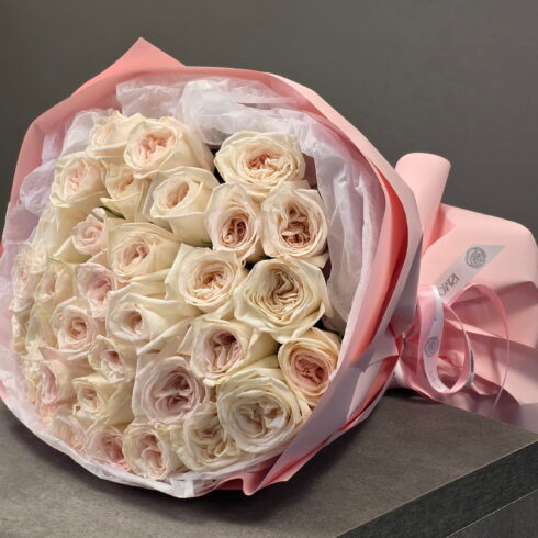 O’Hara garden roses hand-tied bouquet in blush wrapping by BLOOMSI Toronto