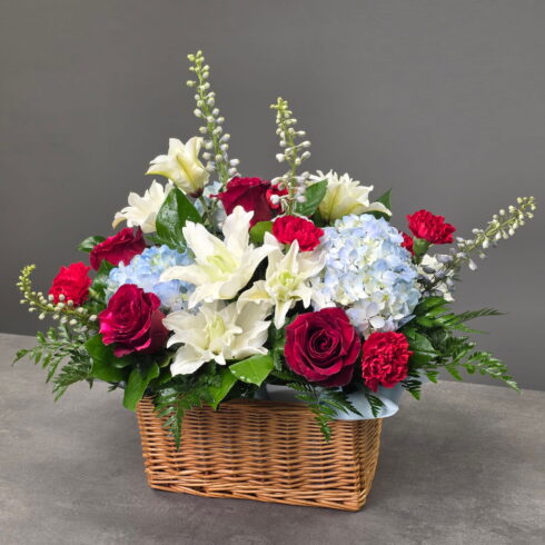 funeral flower basket arrangement in Oakville with lilies roses and hydrangea